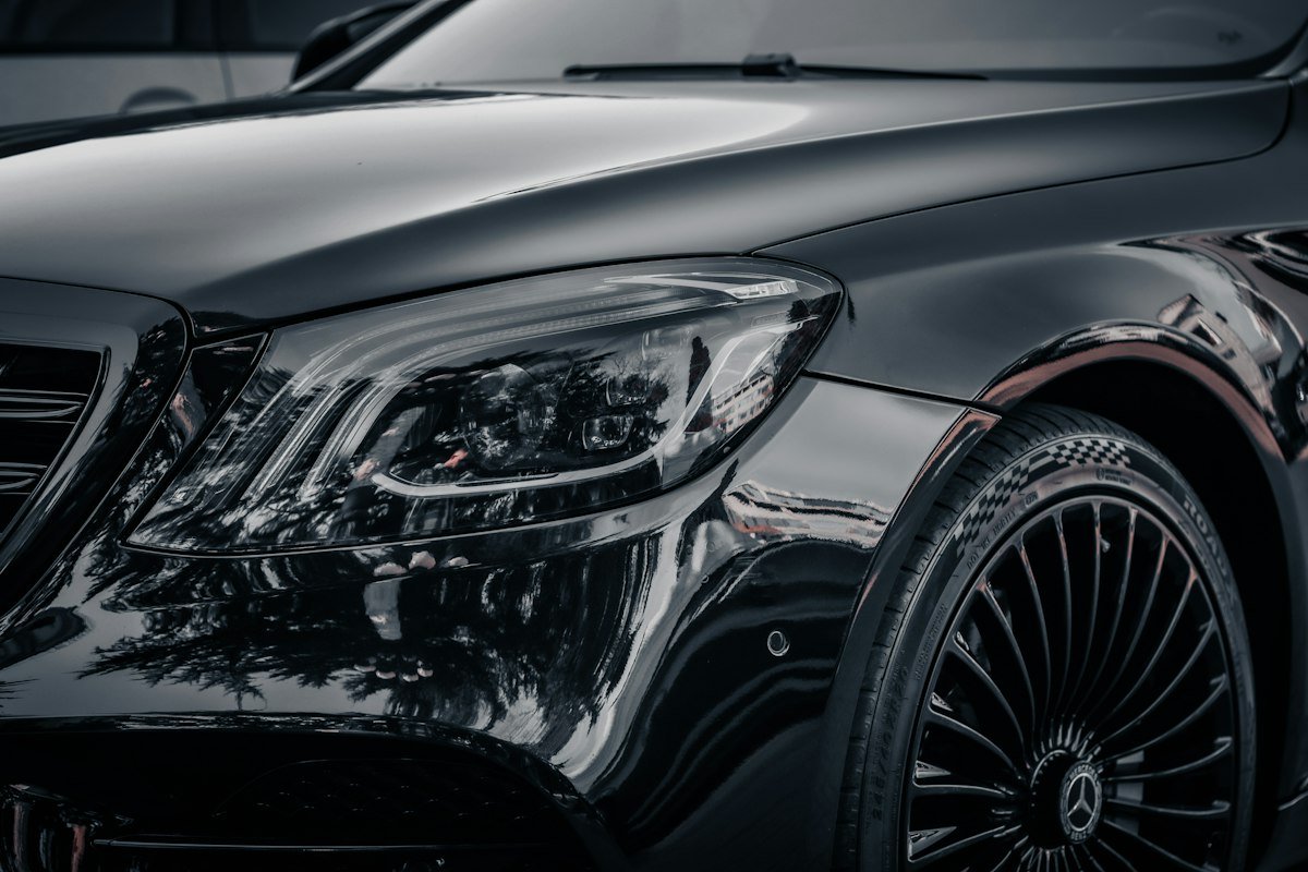 Glossy black Mercedes after a ceramic coating detail